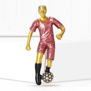 Creative soccer player brooch in red and gold enamel, sporty motion action pose