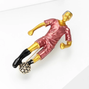 Detail showing the football player brooch back pin and vibrant enamel textures