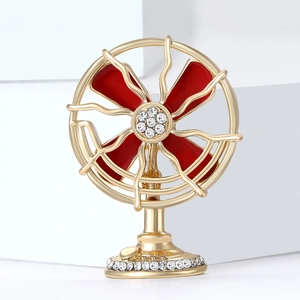 Vintage gold fan brooch with red enamel and sparkling rhinestones for suits