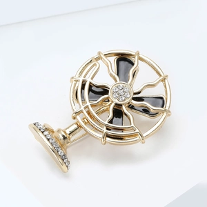 Detailed close-up of retro alloy fan brooch with black enamel and sparkling crystals