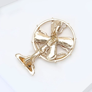 Detailed back view of vintage electric fan brooch with secure pin clasp mechanism
