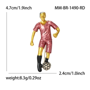Creative soccer player brooch in red and gold enamel, dimensions 4.7cm by 2.4cm