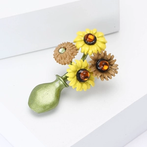 Sunflower bouquet brooch in green enamel vase featuring bright yellow petals and beads