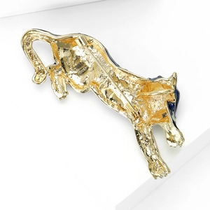 Golden cheetah brooch with blue enamel details and a secure pin fastening mechanism