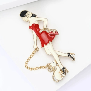 Detailed enamel brooch featuring a woman walking a pet dog with a golden metal chain