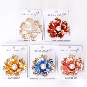 Detailed set of five floral brooches with colorful enamel petals and faux pearl centers