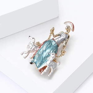 Detailed close-up of an elegant lady walking two dogs enamel brooch on white blocks