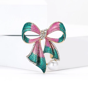 Broche nœud rose et cyan avec strass en cristal et élégante perle blanche pendante