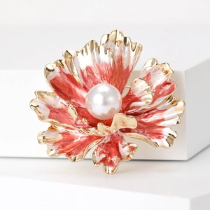 Close-up of elegant peony flower brooch with enamel petals and a large pearl center
