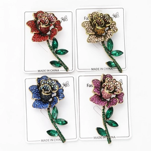 Detailed grid of rose floral brooches with shimmering rhinestones in four elegant colors