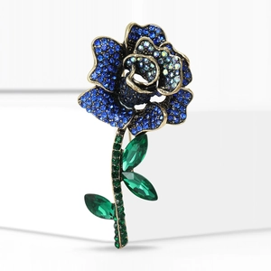 Elegant rose flower brooch with blue and green rhinestones in luxury vintage gold finish