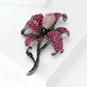 Elegant rose flower brooch with pink and green rhinestones on silver base