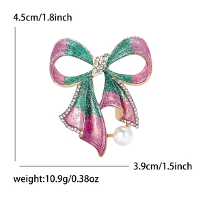 Broche nœud étincelante avec dégradé rose et vert, strass et perle blanche pendante
