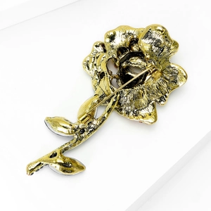 Rear view of gold rose brooch with safety pin clasp made of high-quality plated alloy