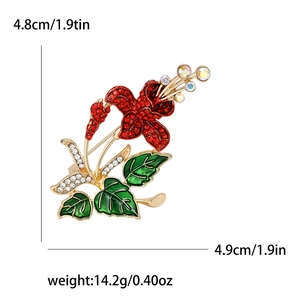 Sparkling red hibiscus flower brooch with green enamel leaves and gold plating details