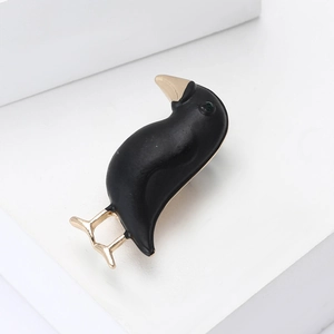 Matte black crow brooch with gold beak and green gemstone eye for suits and coats