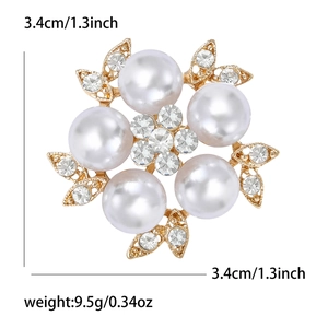 Detail showing the 3.4cm diameter flower brooch with pearls and crystal rhinestones