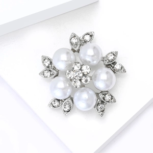 Elegant flower brooch featuring five large faux pearls and sparkling crystal petals
