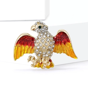 Golden alloy eagle brooch with white crystals and red-yellow gradient enamel finish