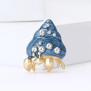 Exquisite hermit crab brooch with blue enamel shell and sparkling white zircons