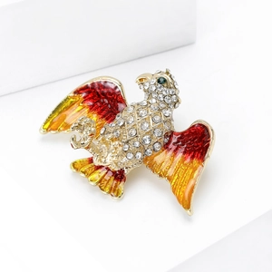 Detailed view of eagle brooch with colorful enamel wings and crystal rhinestones
