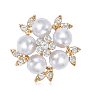 Elegant floral brooch featuring white faux pearls and sparkling rhinestones on gold metal