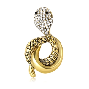 Elegant gold snake brooch with sparkling rhinestones and black gem eyes on white background
