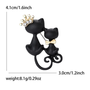 Matte black twin cats brooch with rhinestones and gold crowns measuring 4.1cm tall