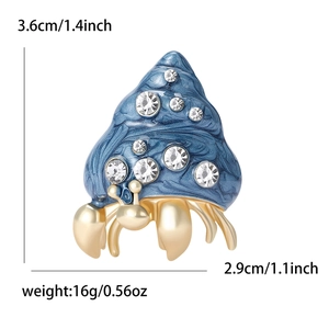 Hermit crab enamel brooch with blue shell and rhinestones in gold finish, 3.6x2.9cm