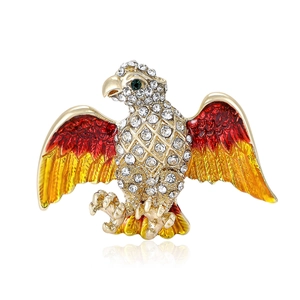 Eagle brooch with gold alloy base featuring gradient enamel wings and crystal inlay