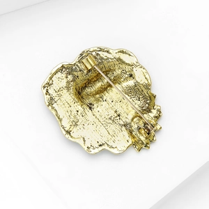 Back view of vintage gold leaf frog brooch showing secure pin and hammer textures