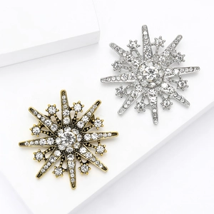 Vintage snowflake brooch pins in gold and silver finish with sparkling crystal accents