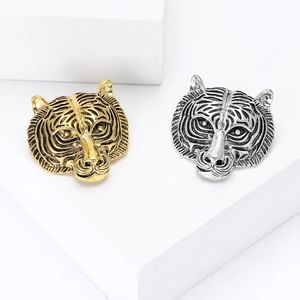 Vintage alloy tiger head brooch in gold and silver finish with detailed textures