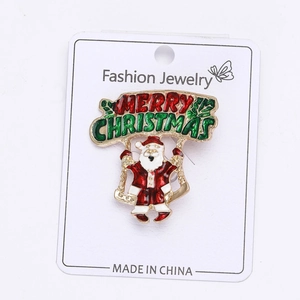 Détail de la broche émaillée Père Noël avec bannière Merry Christmas sur sa carte