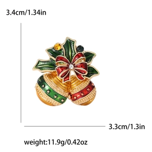 Broche cloche de Noël en émail avec nœud rouge, feuilles vertes et strass scintillants