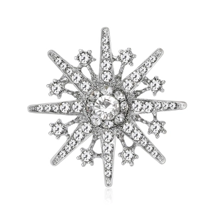 Vintage snowflake brooch with sparkling crystals and silver tone metal finish