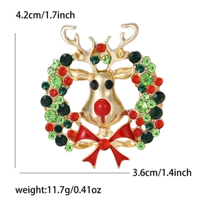 Broche couronne de renne de Noël avec strass colorés et nœud papillon en émail rouge