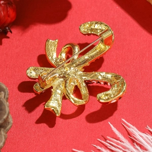 Christmas candy cane brooch with gold-plated back and secure safety pin fastener
