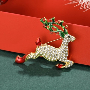 Broche de renne de Noël avec strass blancs et émail vert sur monture en alliage doré