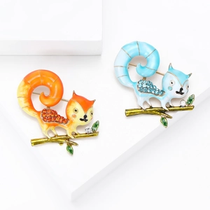 Cute squirrel brooches with rhinestones and colorful enamel on a polished branch base