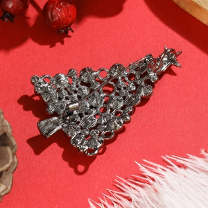 Hollow Christmas tree brooch in gunmetal finish with star topper and pin clasp