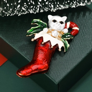 Christmas cat and stocking brooch with enamel details and faux pearl on festive background