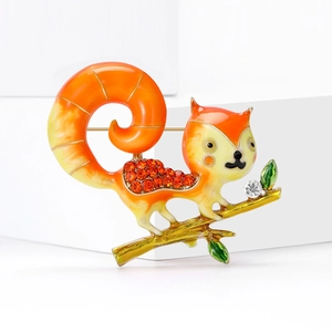 Cute squirrel brooch with orange enamel crystals and zirconia on golden branch