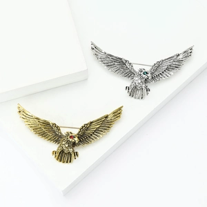 Retro eagle brooches in antique gold and silver with jeweled eyes and detailed feathers