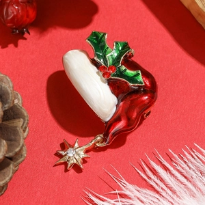 Creative Christmas boot brooch with enamel finish, green leaves and a gold star pendant