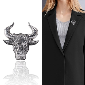Vintage silver bull head brooch and pendant dual-use accessory on black suit lapel
