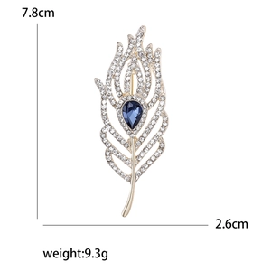 Eleganter Feder-Brosche in Gold mit blauem Birnenstein und Kristallen, 7,8cm Größe