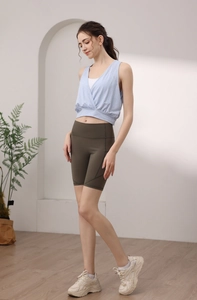 Detail of light blue jacquard yoga tank top with stylish back cross design for women