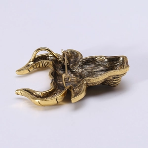 Retro bull head brooch in golden alloy with sturdy safety pin closure on the back