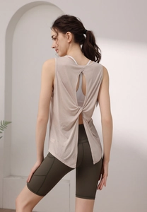 Detail of tencel workout tank top featuring a stylish back twist and open back cutout